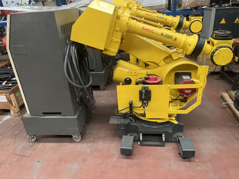 ROBOT ANTROPOMORFO R-2000iA ASSI:6 SBRACCIO:2000 kg PORTATA AL POLSO:165 kg PREDISPOSIZIONE:MANIPOLAZIONE ANNO DI COSTRUZIONE:2002 COMPLETO DI:CAVI DI ALIMENTAZIONE-QUADRO ELETTRICO-TASTIERINO DI PROGRAMMAZIONE ROBOT RICONDIZIONATO(RIVERNICIATO,OLII DEI RIDUTTORI CAMBIATI,BATTERIE A TAMPONE SOSTITUITE) A05B-1324-B203